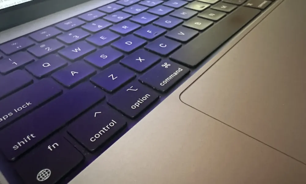Closeup photo of a MacBook Pro M1 laptop keyboard